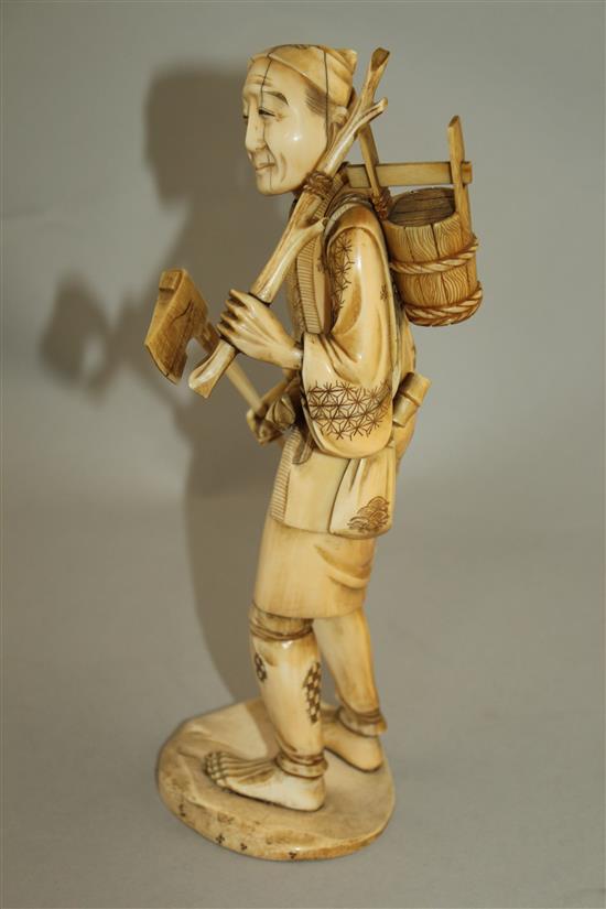 A Japanese sectional ivory figure of a woodsman, early 20th century, 24.5cm